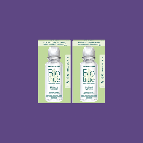 Two 2oz (60mL) bottles of Bausch + Lombs BioTrue Multipurpose Contact Lens Solution Travel Kit are displayed against a purple background, highlighted for providing up to 20 hours of moisture. This solution is ideal for silicone hydrogel lenses, offering comfort and clarity on the go.