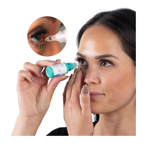 A woman uses the Precision Dropper Eye Drop Assist Device to apply eye drops to her right eye, holding the mess-free applicator above her eye with one hand and gently pulling down her eyelid. An inset shows a close-up of the device in use.