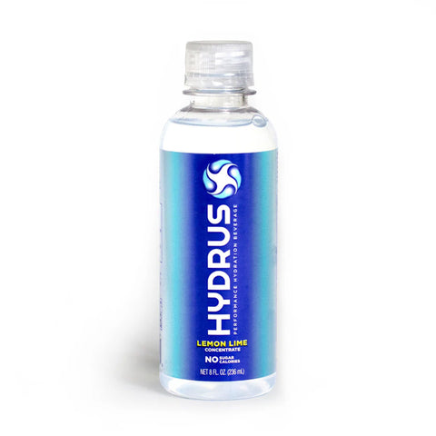 The Hydrus Performance clear plastic bottle holds 8oz of lemon-lime concentrate with a blue and white design. It features a sugar-free electrolyte formula using Nanosome™ Technology for advanced hydration, supporting eye health and whole-body hydration. It is sealed with a transparent cap.
