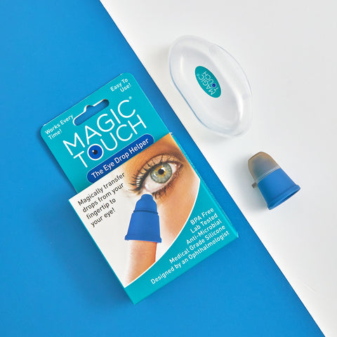 The Magic Touch Eye Drop Applicator is displayed on a blue and white background, featuring a sleek blue and beige design. It includes an antimicrobial agent for easy use and waste reduction, shown with its packaging in a convenient clear plastic case.