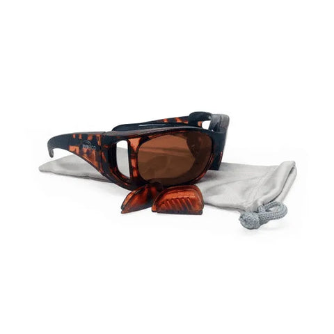 The EyeEco Small Moisture Release Eyewear by PRN, featuring a red tortoise frame with copper lenses, is displayed on a light gray fabric pouch. These stylish sunglasses include anti-fog technology and detachable side shields against a plain white background.