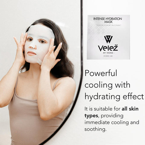 A person applies a white Velez Intense Hydration Cellulose Face Mask while looking in a mirror. Its packaging highlights cooling and hydrating effects that promote regeneration, suitable for all skin types.