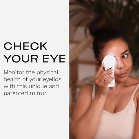 Using the i-Chek Illuminated Self Eye Examination Mirror, a person examines their eyelid with 10X magnification to ensure eyelid hygiene and monitor health.