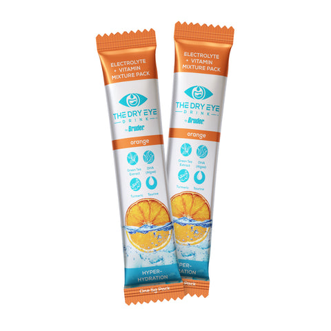 Two packets of Bruders Dry Eye Drink™ Daytime feature an orange flavor and packaging with a sliced orange and water splash, highlighting green tea, ginseng, turmeric, and goji berries for eye health.