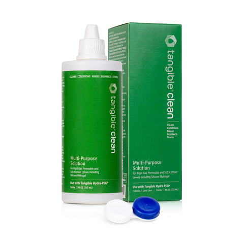 A green Tangible Clean Multi-Purpose Solution bottle for RGP, scleral, and soft lenses sits beside its matching box. An open contact lens case with blue and white lids awaits Hydra-PEG coated lenses. The bottle features white text detailing its multipurpose uses.