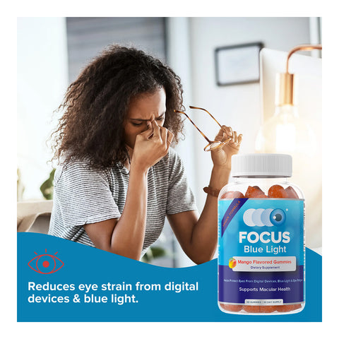 A woman rubs her eyes while holding glasses at a table. In front is a bottle of Focus Vitamins Blue Light Mango Flavored Gummies, enriched with lutein and zeaxanthin. Text reads, Reduces eye strain from digital devices & blue light. This is a 60-count, 1-month supply.
