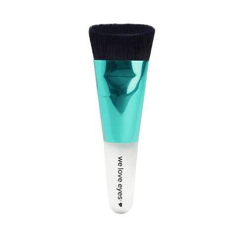 The We Love Eyes - Lashfull Thinking cleansing brush, vegan and cruelty-free, showcases black bristles, a metallic teal handle, and a white base with we love eyes and a small heart. This essential eyelash cleansing brush promotes healthy eyelid margins for gentle care. Oil not included.