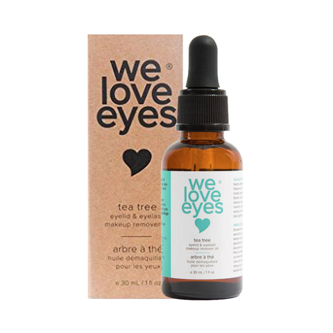 A small brown 30mL glass bottle with a dropper cap and the label We Love Eyes is next to a matching box. The set highlights it as an all-natural eye makeup remover infused with Australian Tea Tree Oil and organic jojoba oil for gentle cleansing of eyelids and eyelashes.