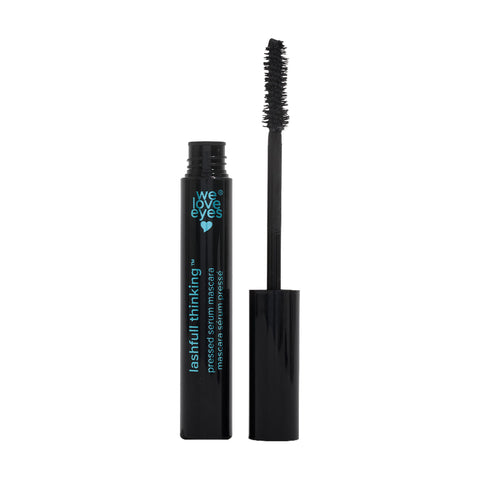 A black mascara tube with the cap off reveals a black bristled wand. The tube, inscribed with turquoise We Love Eyes and Lashfull Thinking, promises volumizing lashes using its Widelash™ formula, set against a crisp white background.