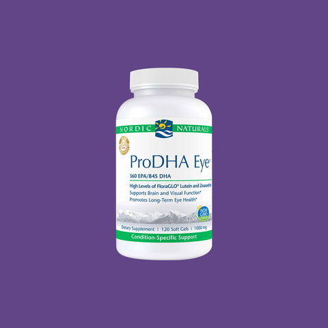 A bottle of Nordic Naturals ProDHA Eye supplement, displayed on a purple background. The label highlights 360 EPA/845 DHA, promoting brain and visual function. Enhanced with lutein and zeaxanthin, it contains 120 soft gels (1000 mg each) for long-term eye health.