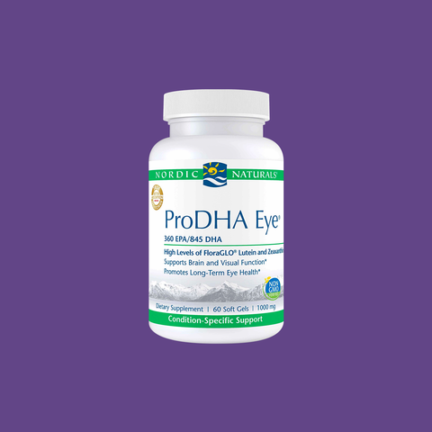 A Nordic Naturals ProDHA Eye bottle, set against a purple background, highlights its advanced omega-3 content with lutein and zeaxanthin, promoting vision and eye health. The bottle contains 60 soft gels.