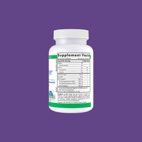 A white bottle of Nordic Naturals ProDHA Eye sits against a rich purple backdrop, highlighted by key ingredients Lutein and Zeaxanthin for eye health. The cap is securely fastened to preserve the Advanced Omega-3 contents inside.