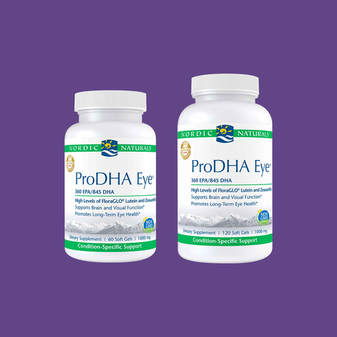 Two bottles of Nordic Naturals ProDHA Eye supplements, featuring DHA, Lutein, and Zeaxanthin for brain and eye health, sit on a purple background.