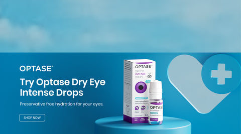 Advertisement for Optase Dry Eye Intense Drops. Shows a product bottle and box on a blue pedestal with a heart and cross symbol. Text reads: Try Optase Dry Eye Intense Drops. Preservative free hydration for your eyes.