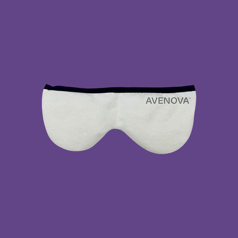 The Avenova Microwavable Heat Eye Compress Mask by NovaBay, featuring a white design with a black band and AVENOVA in gray text on the right, offers reusable comfort and blepharitis relief. Set against a purple background, its perfect for those seeking dry eye treatment solutions.