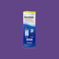 A box of Boston Advance Conditioning Solution (3.5oz) by Bausch & Lomb is set against a purple background. The blue and white packaging, designed for gas permeable lens users, highlights its multi-polymer cushioning system with text and product images.