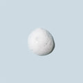 The Daily Practice Purifying Foam Cleanser (80mL) features gentle, hydrating foam bubbles against a light gray background, exuding minimalism and airiness. Ophthalmologist-developed for eyes and lashes, it embodies care in every application.