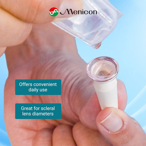A hand holds a scleral lens applicator with a lens on it as another hand pours preservative-free saline from a Menicon Lacripure Sterile Saline Solution vial. Text reads: Ideal for easy daily use with scleral lenses. Logo at the top.