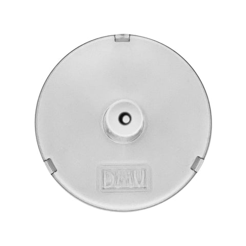 A clear circular object resembling the DMV Vented Scleral Cup features a central raise and four tabs, designed for handling scleral lenses. The embossed DHW suggests its function, matching the DMV Scleral Contact Lens Inserter Stand for Easy insertion.