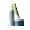 Daily Practices Three Step Eye Care Routine Bundle is beautifully presented on a white background, featuring a purifying foam pump, a nourishing moisture treatment jar, and an ophthalmologist-formulated retexturizing treatment tube to elevate your eye care routine.