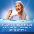 A smiling woman with long gray hair holds a tube of Refresh PM Lubricant Nighttime Eye Ointment by Abbvie. She stands against a blue background with a water splash at the bottom. Text reads, Designed to relieve intense irritation and discomfort due to dry eyes.