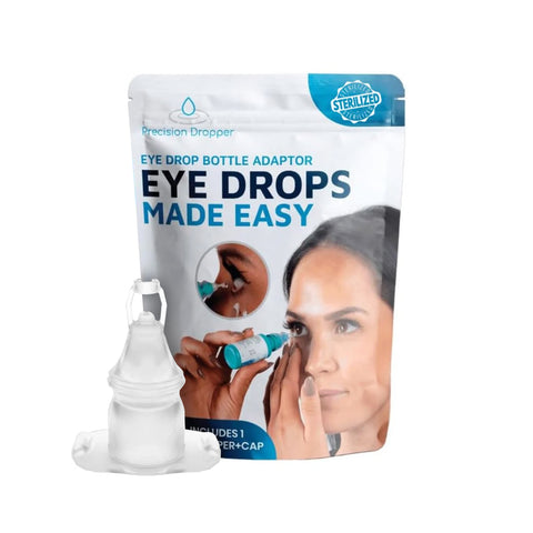 The Precision Dropper Eye Drop Assist Device package shows a woman using the mess-free eyedrop adapter. In front is a clear adaptor with cap, designed to reduce waste and ensure precise application. Compatible with most bottles.