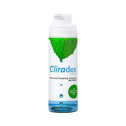 A tall cylinder bottle of PRN Cliradex Light Foam features mint leaves at the top, blue text, and water droplets. Infused with tea tree oil for superior eye hygiene, it includes a green seal stating All Natural and Preservative Free.