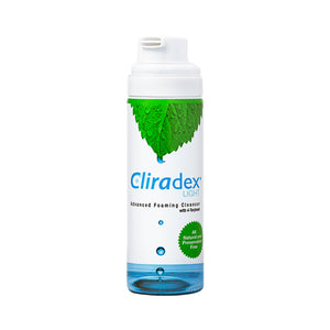 A tall cylinder bottle of PRN Cliradex Light Foam features mint leaves at the top, blue text, and water droplets. Infused with tea tree oil for superior eye hygiene, it includes a green seal stating All Natural and Preservative Free.