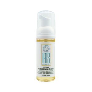 The IRIS Tea Tree Cleanser Foam for Eyelids by Iris Eyecare comes in a 50mL cylindrical bottle with a pump dispenser. Its label is mainly white with blue and gold accents, perfect for hydrating and soothing.