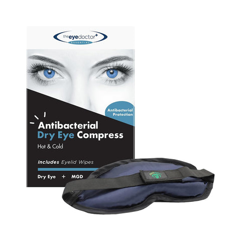The Eye Doctor Essential Eye Compress, a microwavable hot and cold compress, is packaged alongside a dark blue adjustable strap eye mask. Featuring blue eyes on the design, it includes eyelid wipes for Dry Eye Disease and MGD relief, providing soothing comfort to blepharitis sufferers.