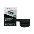The Eye Doctor Stye Relief Compress box features a blue eye image and includes eyelid wipes for gentle cleansing. Next to the box is a black fabric, reusable microwaveable hot eye mask with a strap for effective moist heat treatment.