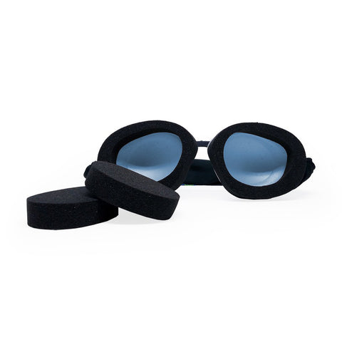 The Eyeeco Tranquileyes Mini by PRN features a black mask with blue-tinted lenses and detachable memory foam rings, set against a plain white background.