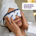 A person in a towel turban and white robe relaxes while using Bruder Hygienic Eyelid Sheets with a Bruder moist heat mask, highlighting essential eyelid hygiene. Text reads, For use with Bruder moist heat mask.