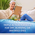 A gray-haired woman sits on a couch, smiling at her tablet, wearing a beige cardigan and blue jeans. Below her, a blue banner reads: Refresh Optive Advanced Eye Drops by Abbvie offers triple-action relief with Hydrocell Technology for dry, burning, or irritated eyes.