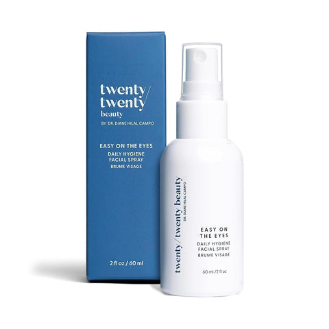 A white spray bottle labeled Twenty Twenty Daily Hygiene Facial Spray (Hypochlorous Spray) sits beside a matching blue box. This calming face mist contains 60 ml (2 fl oz) and is ophthalmologist approved for gentle, everyday use.