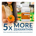 Someone holds an orange bell pepper next to an EyePromise Zeaxanthin + Lutein Eye Vitamin bottle, highlighting 5x MORE ZEAXANTHIN for improved eye health, stressing how increased zeaxanthin and lutein offer superior protection.