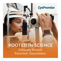 A woman undergoes an eye examination using an ophthalmic device, assisted by a person. The display shows EyePromise, promoting the EyePromise Zeaxanthin + Lutein Eye Vitamin (60 Softgels) for eye health—scientifically rooted and proven with patented, guaranteed results.