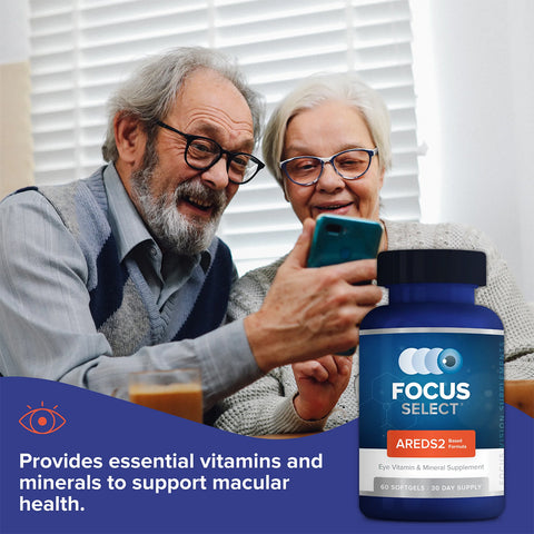 An elderly couple smiles at a smartphone with Focus Vitamins Focus Select Supplement - AREDS2 formula for Macular Degeneration (180ct, 90 Day Supply) in the foreground, highlighting its AREDS2-based formula to support macular health and combat AMD.