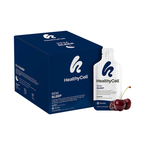 The HealthyCell REM Sleep Supplement box in dark blue features branded packaging with a cherry-labeled gel pack upfront. Two cherries accentuate the calming herb blend aimed at supporting sleep cycles, with the HealthyCell logo prominently displayed on both the box and packet.
