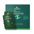 Image of a Noveha Anti-Demodex Eyelid & Lash Wipes (60ct) box with two individual packets resting against it. The green packaging emphasizes natural ingredients such as tea tree oil, coconut oil, aloe vera, and its hypoallergenic properties.