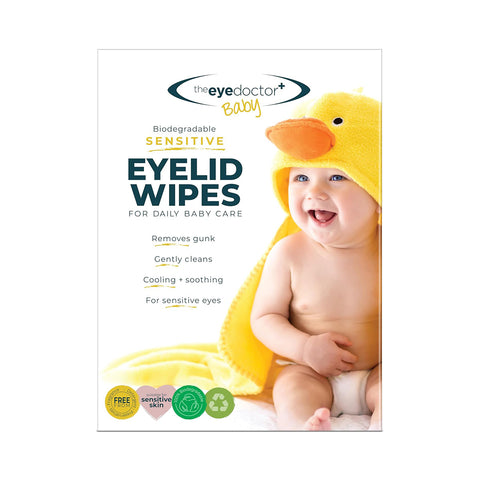 Package image features a smiling baby in a yellow duck-themed towel, highlighting The Eye Doctor Sensitive Baby Eye Wipes. These biodegradable, preservative-free wipes gently clean, cool, and soothe sensitive baby eyes. 20ct wipes offer delicate care for your little one.