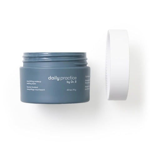 A gray cosmetic jar labeled Daily Practice is open, with the lid hovering above. It reveals the Ophthalmologist-Developed Nourishing Makeup Melting Balm offering Effortlessly Clean & Hydrate in a 2.5 oz / 70 g size by Daily Practice.