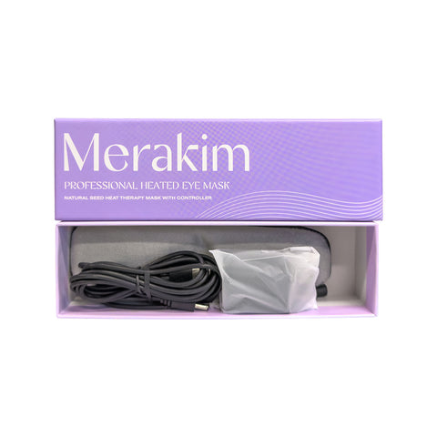 A purple box labeled Merakim Professional USB Heat Eye Mask contains a gray heated eye mask and cord. The packaging features Natural Bead Heat Therapy Mask with Controller and emphasizes the USB-powered ease for enhancing tear film stability.
