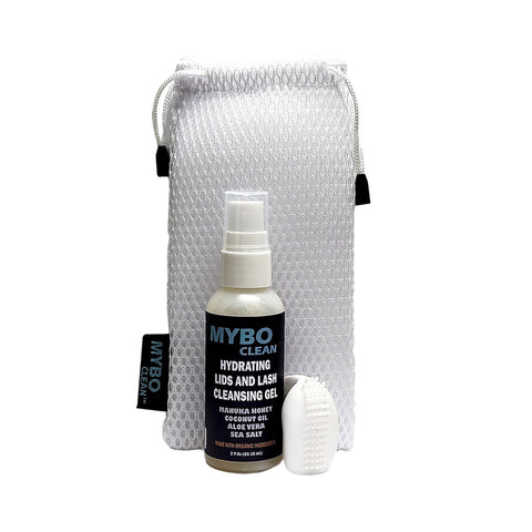 The MyboClean On the Go Brush with Hydrating Gel + Travel Bag, featuring a travel-friendly eyelid hygiene solution, is displayed alongside a textured pouch. The hydrating gel includes manuka honey, coconut oil, aloe vera, and sea salt. A small white applicator accompanies the bottle.