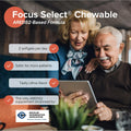 An elderly couple smiles at a tablet featuring Focus Select Citrus Chewable by Focus Vitamins, an AREDS2-based formula for eye health. The supplement offers benefits like 2 daily citrus-flavored softgels, is safer for more patients, and endorsed by the Macular Degeneration Association.