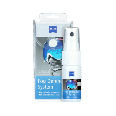 The ZEISS Fog Defender System Anti-Fog Spray for Glasses, by Zeiss, is pictured with a small spray bottle in front of someone wearing goggles. It features an anti-fog spray and microfiber cloth to prevent fogging.