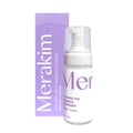 A bottle of Merakim Tea Tree Oil Foam Facial Cleanser (120mL), perfect for soothing dry eye disease and ocular inflammation, is displayed in front of its purple box. The white packaging with purple accents includes a pump dispenser and is labeled for face and eyelids.