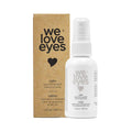 A We Love Eyes Calm Eyelid & Eyelash Cleansing Spray with HypoChlorous, housed in a white bottle featuring black text and a heart icon, sits beside its brown cardboard box. A soothing chamomile infusion and convenient spray nozzle complete its minimalist design.
