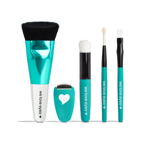 Displayed vertically against a white background, the We Love Eyes Complete Toolkit for Eyelashes includes five teal and white eye care tools for eyelid cleansing. Each tool, ideal for lash and brow grooming, features We Love Eyes with a heart symbol, including brushes and a small heart-cutout device.