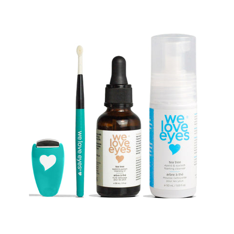 The Stye Cleaning Kit by We Love Eyes offers a teal tool with a heart design, teal brush, small dropper bottle of Australian Tea Tree Oil, and a foaming cleanser bottle, perfect for supporting eyelid health and gentle stye treatment.